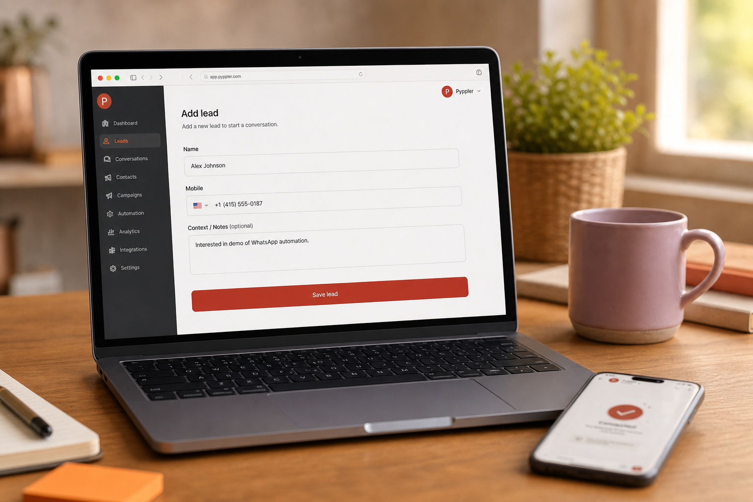 Laptop on a desk showing the Pyppler Add Lead form with name and mobile fields